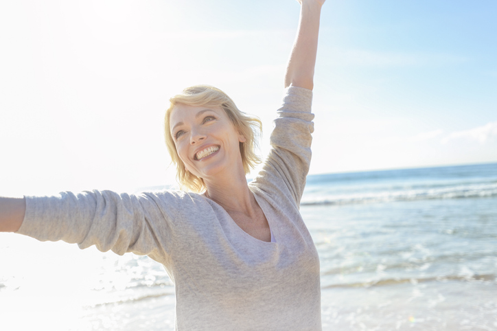 Woman-menopausal-Happy-on-Beach